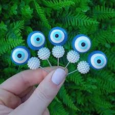 foto_25864_13412.jpg ENFEITE DE CUIA OLHO GREGO COM PEROLA - BOM CHIMA